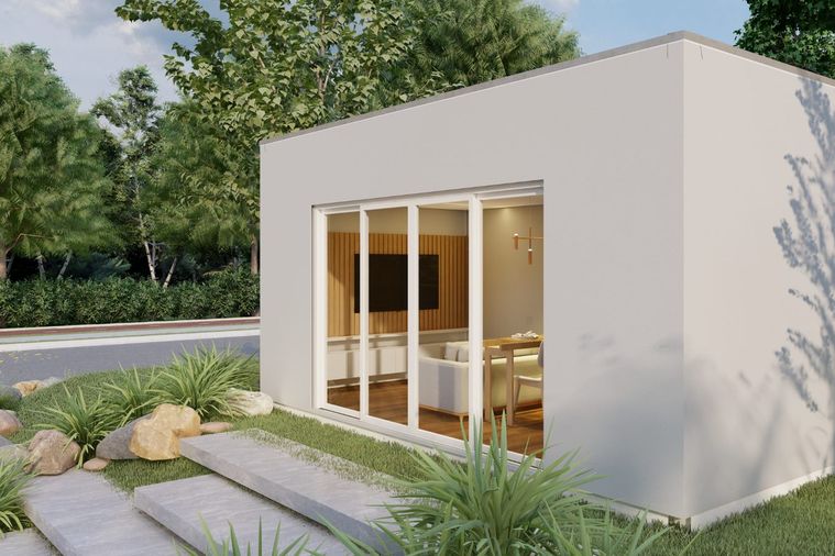 Módulo em light steel frame com fachada branca em capoto e envidraçado de correr,
              instalado num jardim.